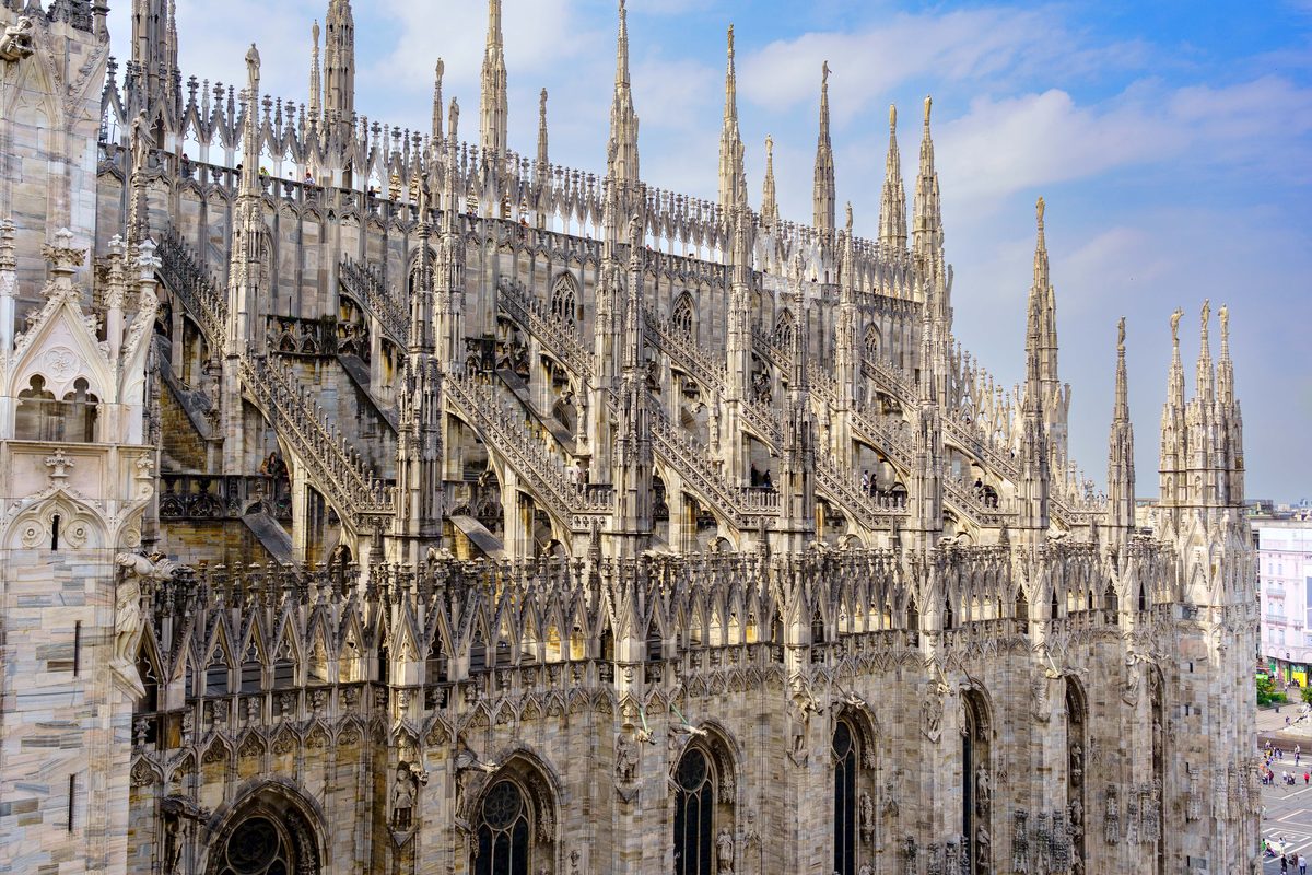 Walking the rooftop terrace of the Duomo di Milano among its spires