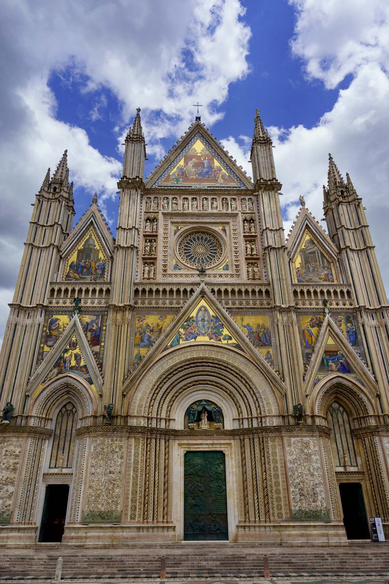The mosaic Gothic facade of the Orvieto Cathedral