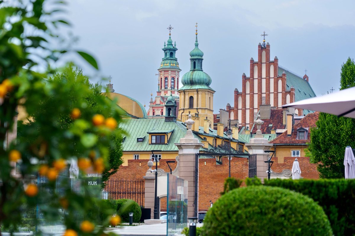 Old Town spires seen through the garden near Hotel Verte in Warsaw