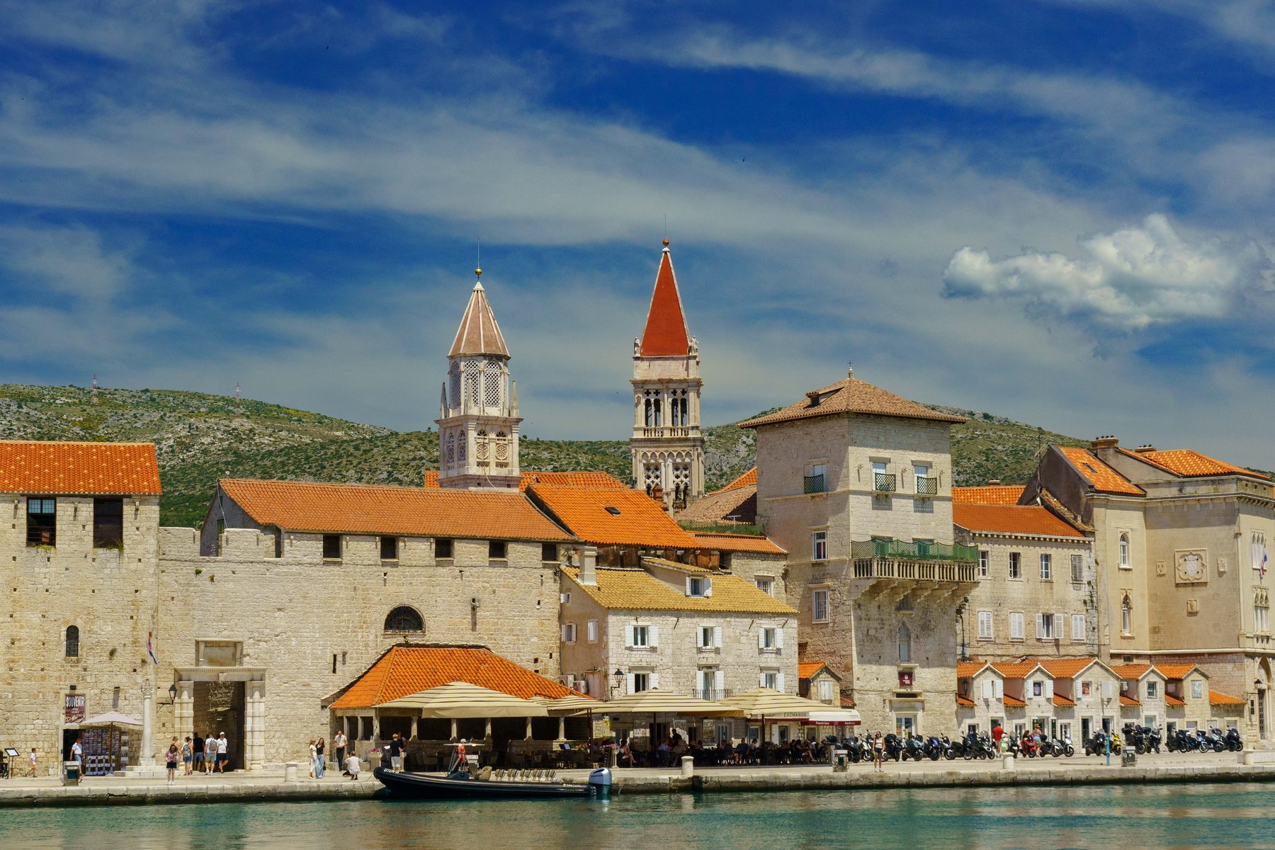 Trogir's old town and twin bell towers seen from the harbor water