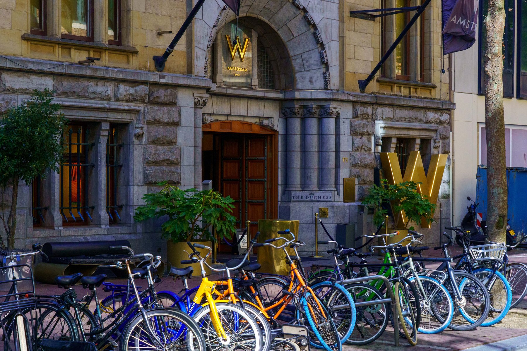 Bicycles parked outside the W Amsterdam hotel entrance