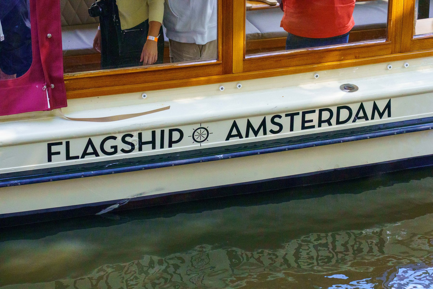 The canal cruise boat Flagship Amsterdam docked along a canal