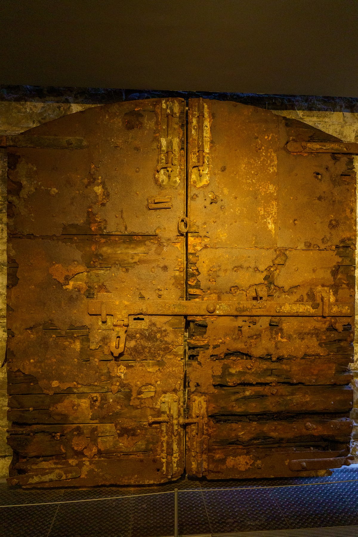 A rusted iron cell door inside Kilmainham Gaol