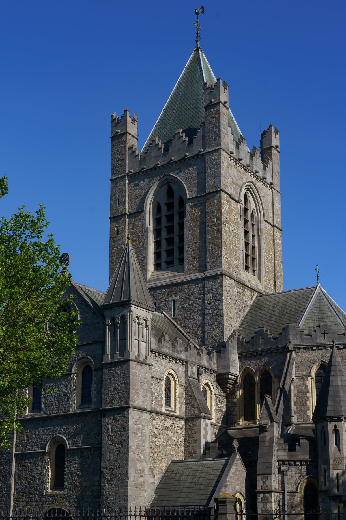 The bell tower of Christ Church Cathedral against a clear blue sky in Dublin