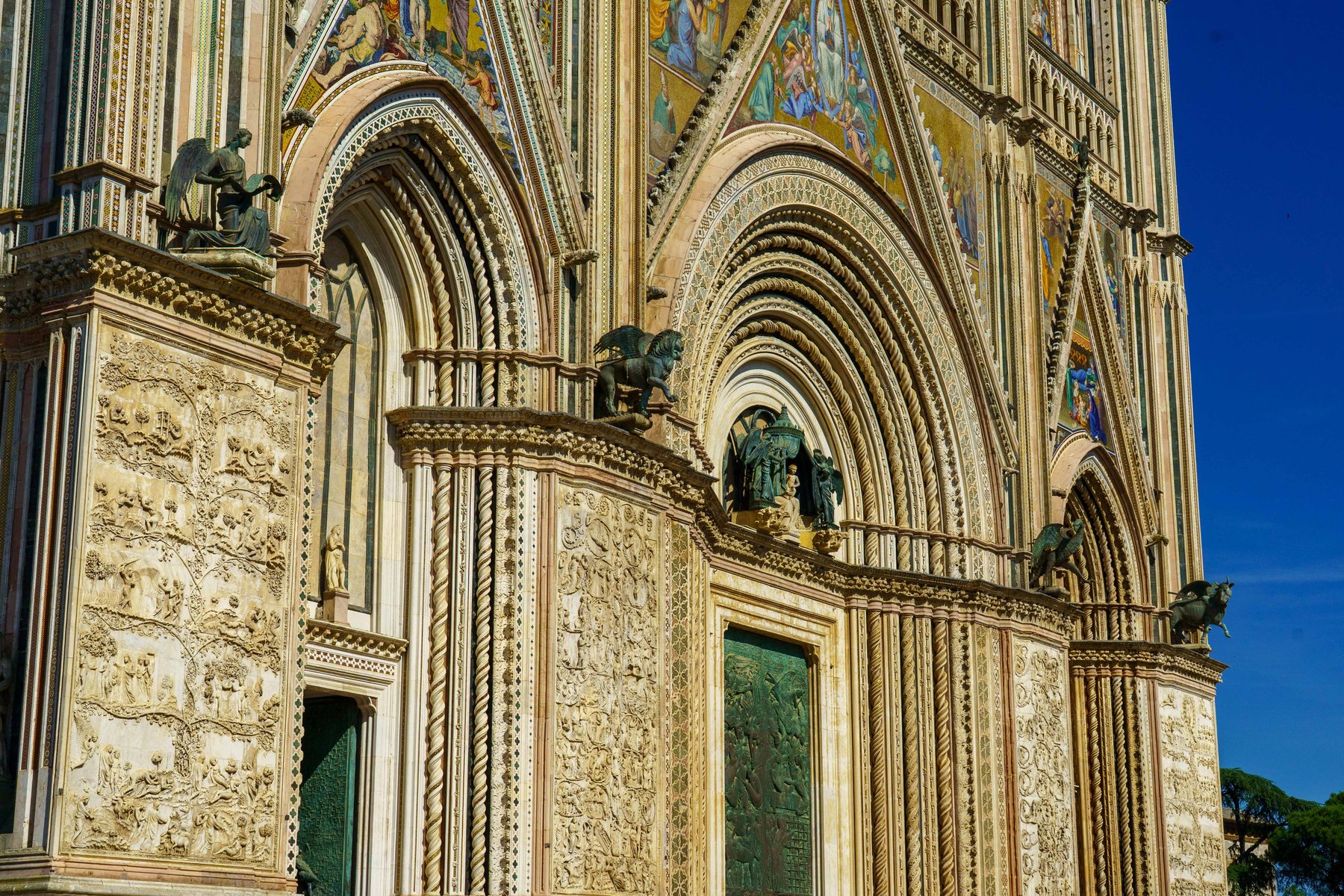 The ornate mosaic facade of the Orvieto Cathedral