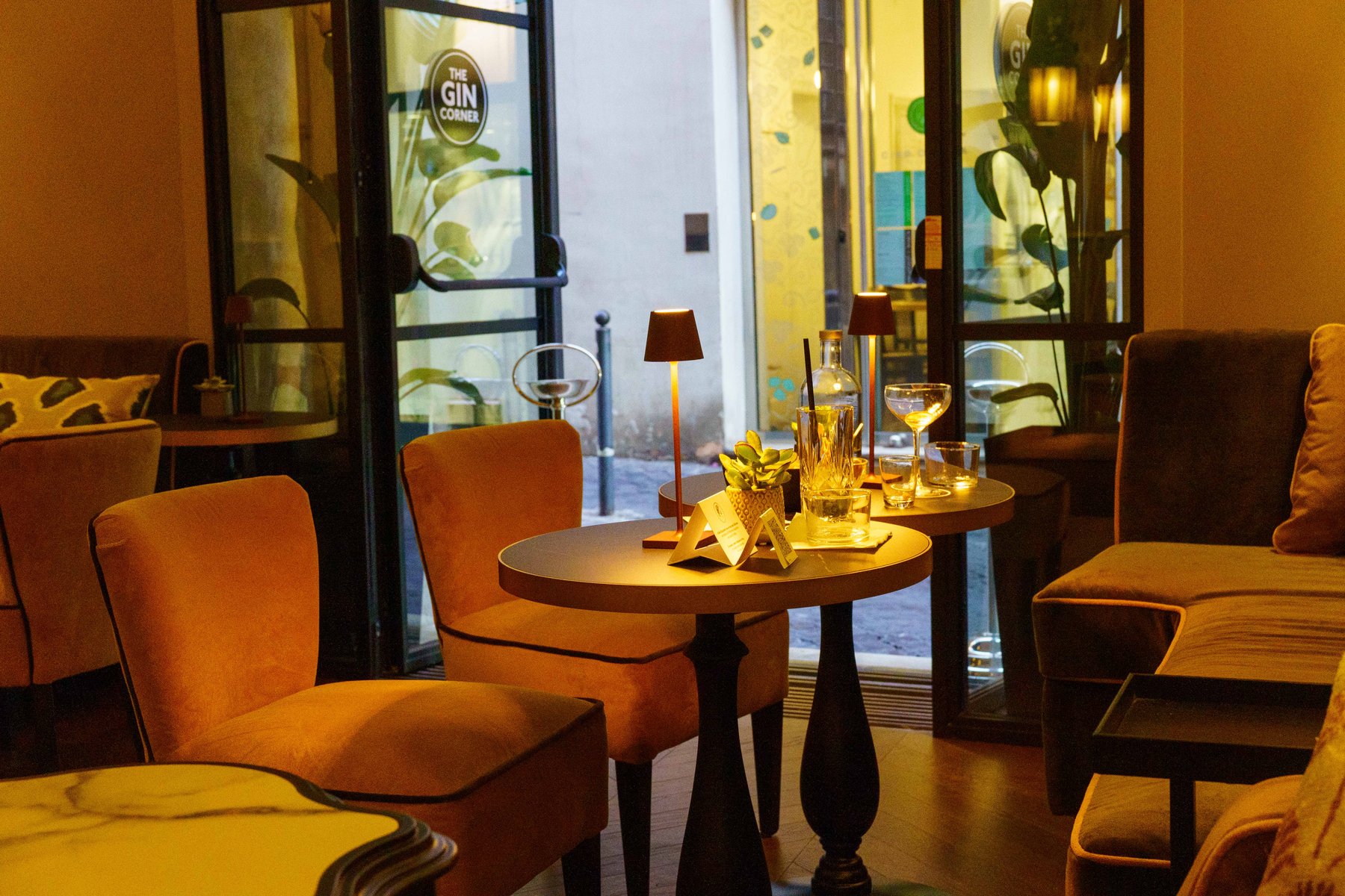 A cozy candlelit lounge at The Gin Corner in Rome