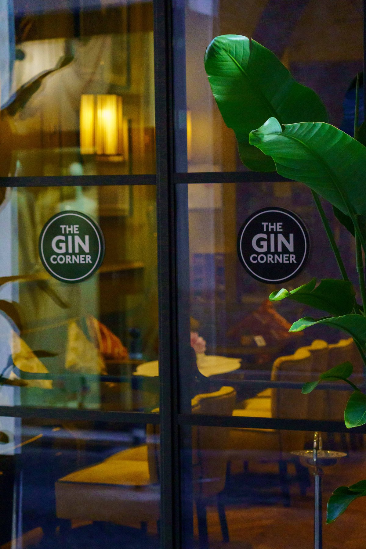 The round window signage of The Gin Corner