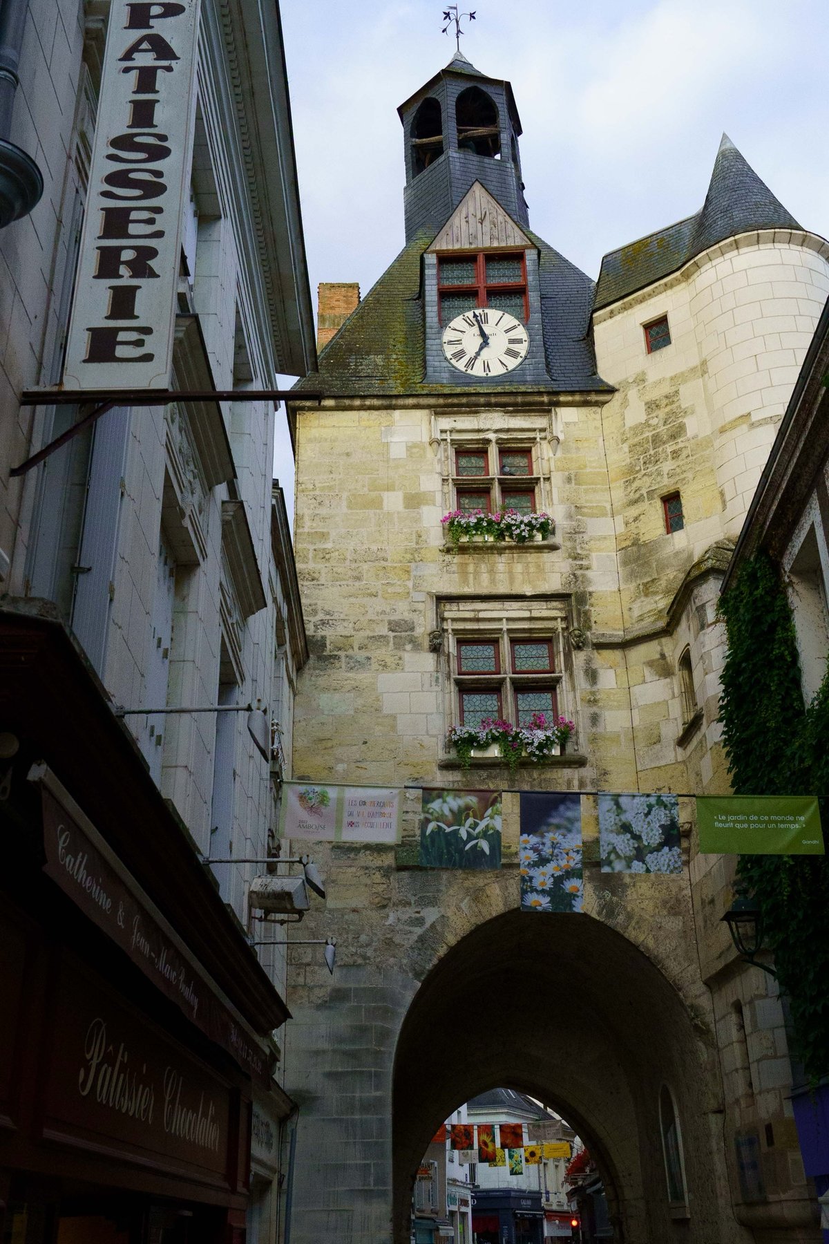 The Tour de l'Horloge archway over a patisserie-lined street in Amboise