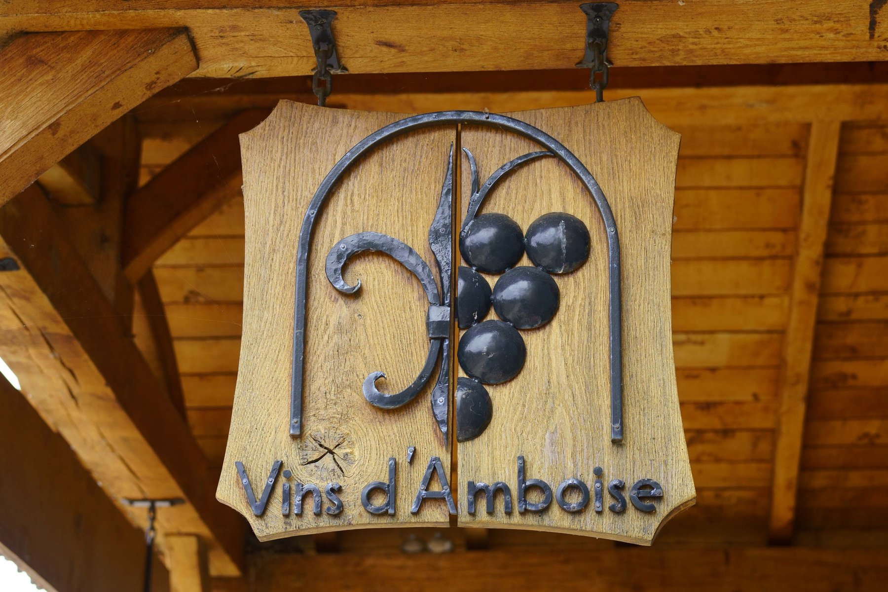 The Vins d'Amboise sign hanging outside a wine cellar