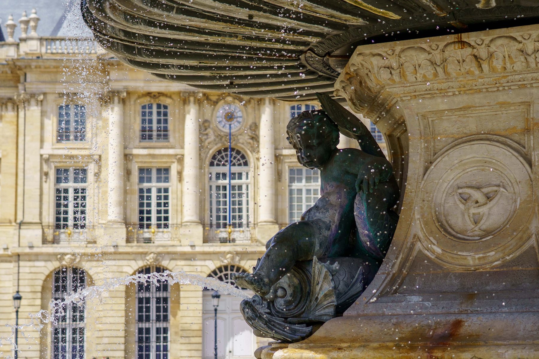 A cherub astride a dolphin, detail of the Fontaine des Trois Graces in Bordeaux