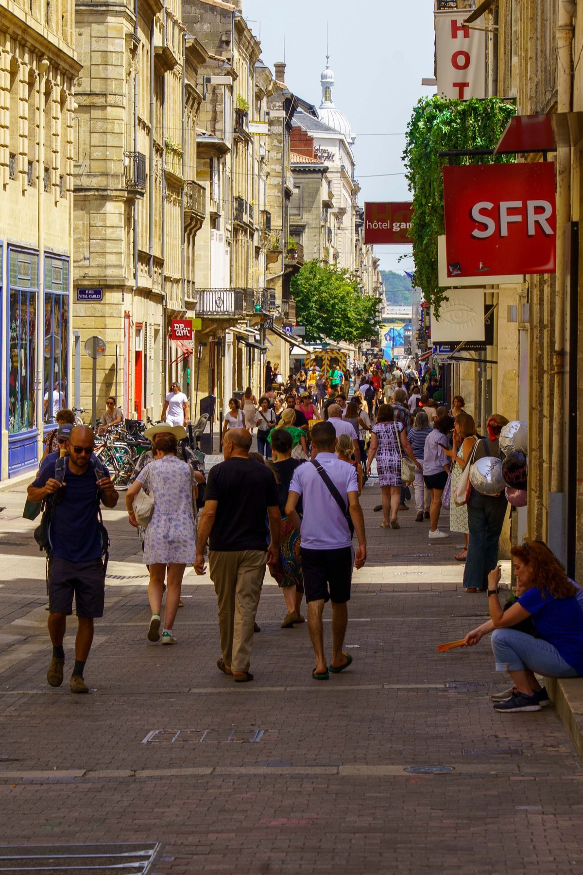 A busy shopping street in the old town of Bordeaux, France