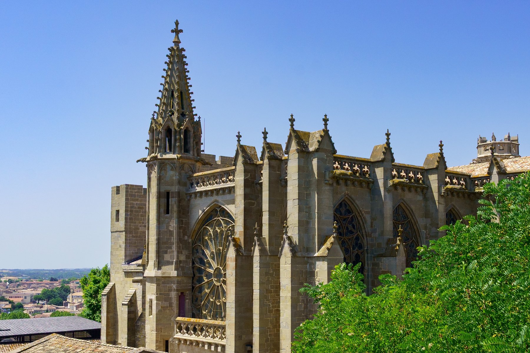 The Gothic rose window and flying buttresses of the Basilique Saints-Nazaire-et-Celse in Carcassonne