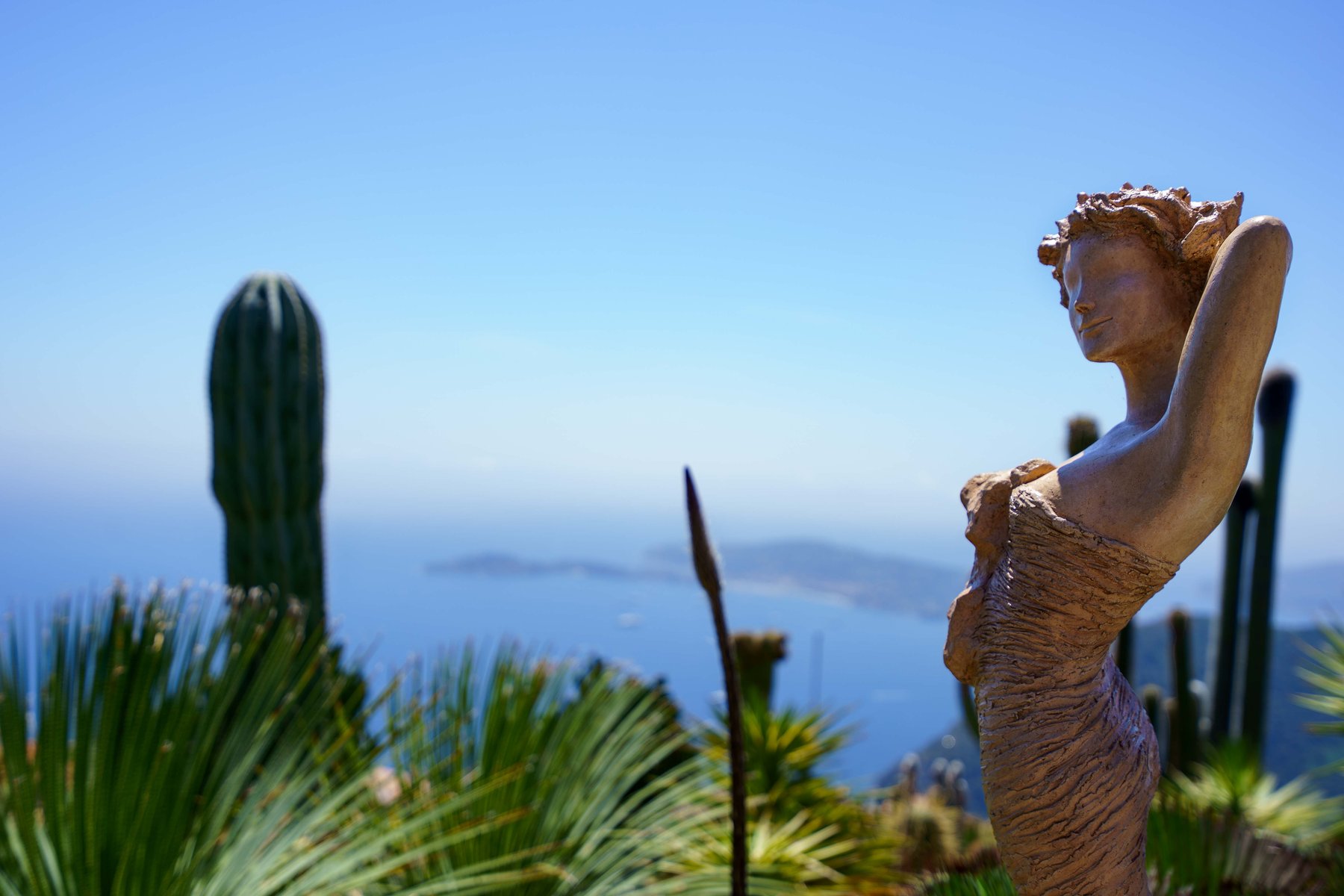 A modern sculpture amid cacti in the Jardin Exotique d'Eze, overlooking the sea