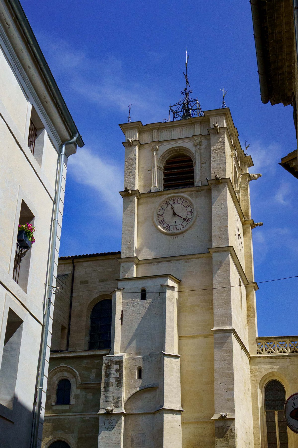 The bell tower of the Collegiale Notre-Dame-des-Anges in L'Isle-sur-la-Sorgue, France