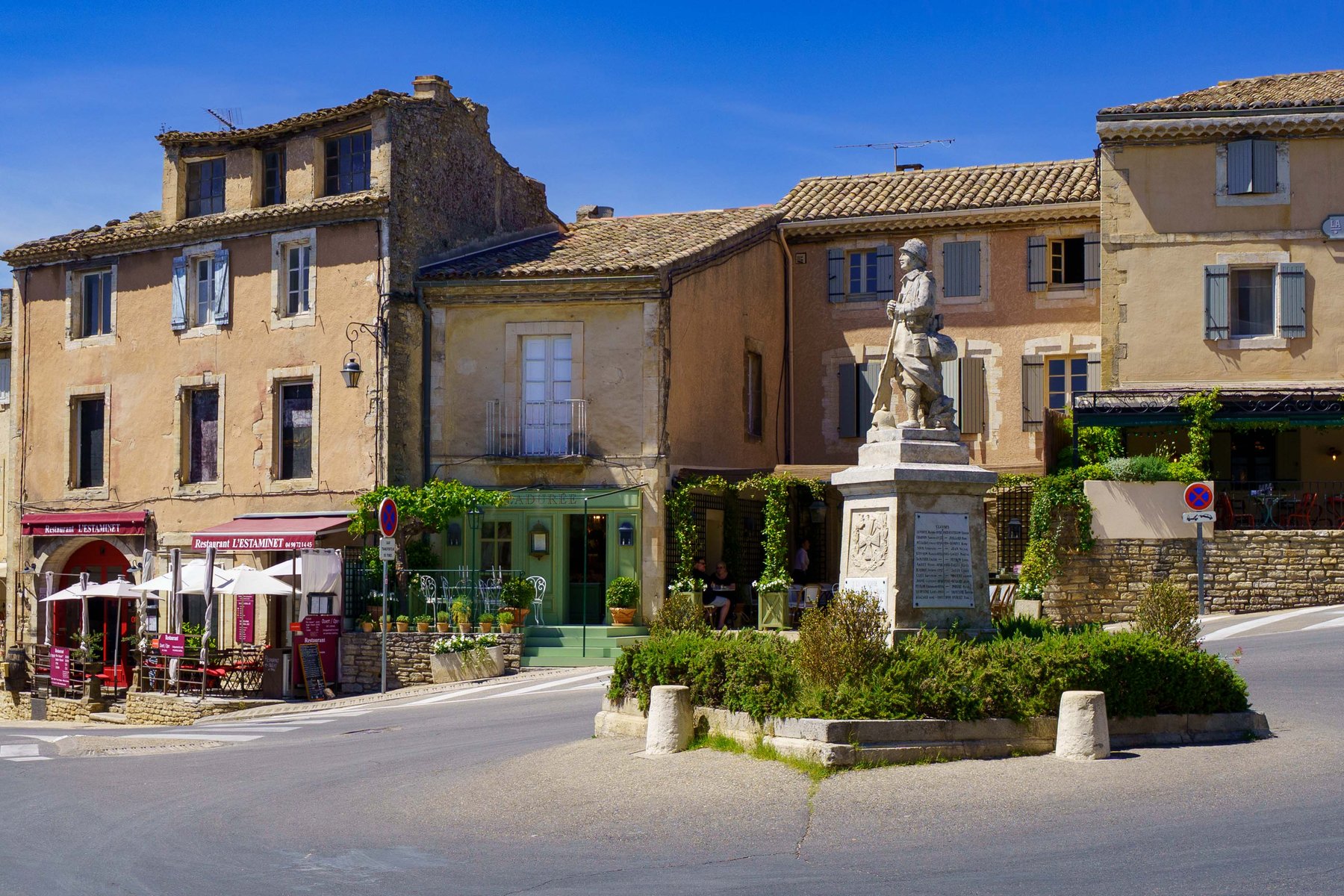 The village square in Gordes, France, with its war memorial statue