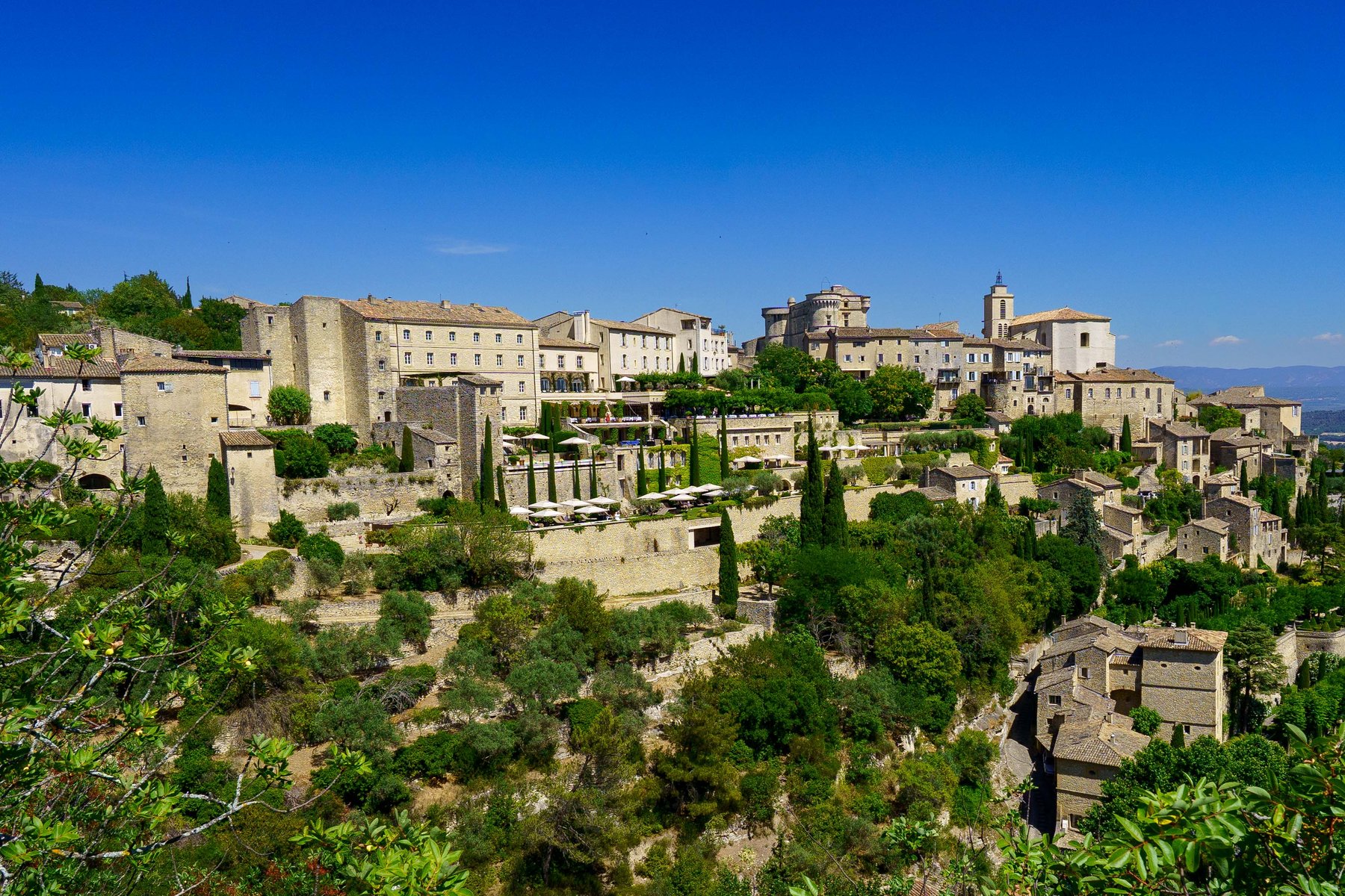 Gordes' hilltop village seen across the valley