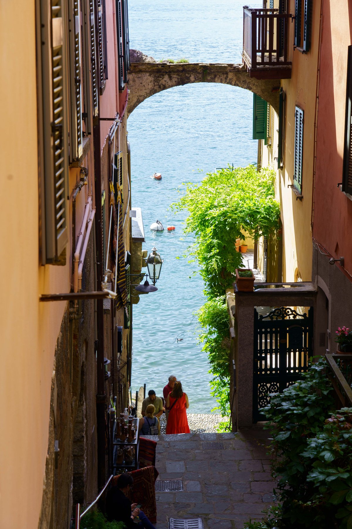 A narrow archway leading down to the water in Bellagio