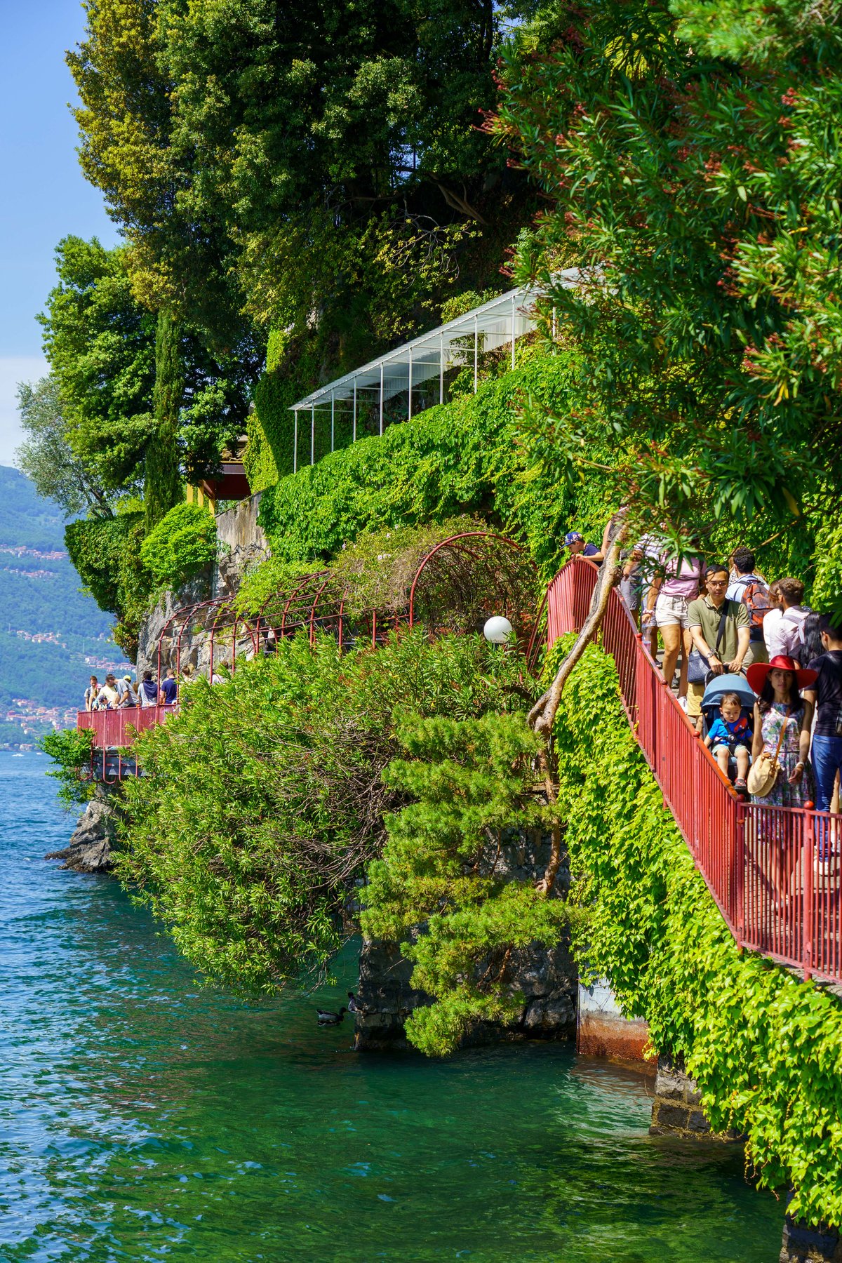 The red-railed lakeside walkway in Varenna