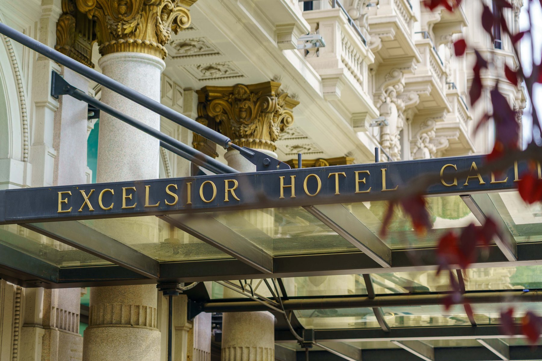 The gold lettered sign of the Excelsior Hotel Gallia in Milan