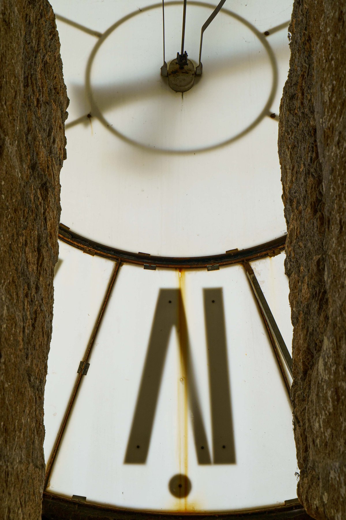 The clock face of the Torre del Moro in Orvieto, viewed from below