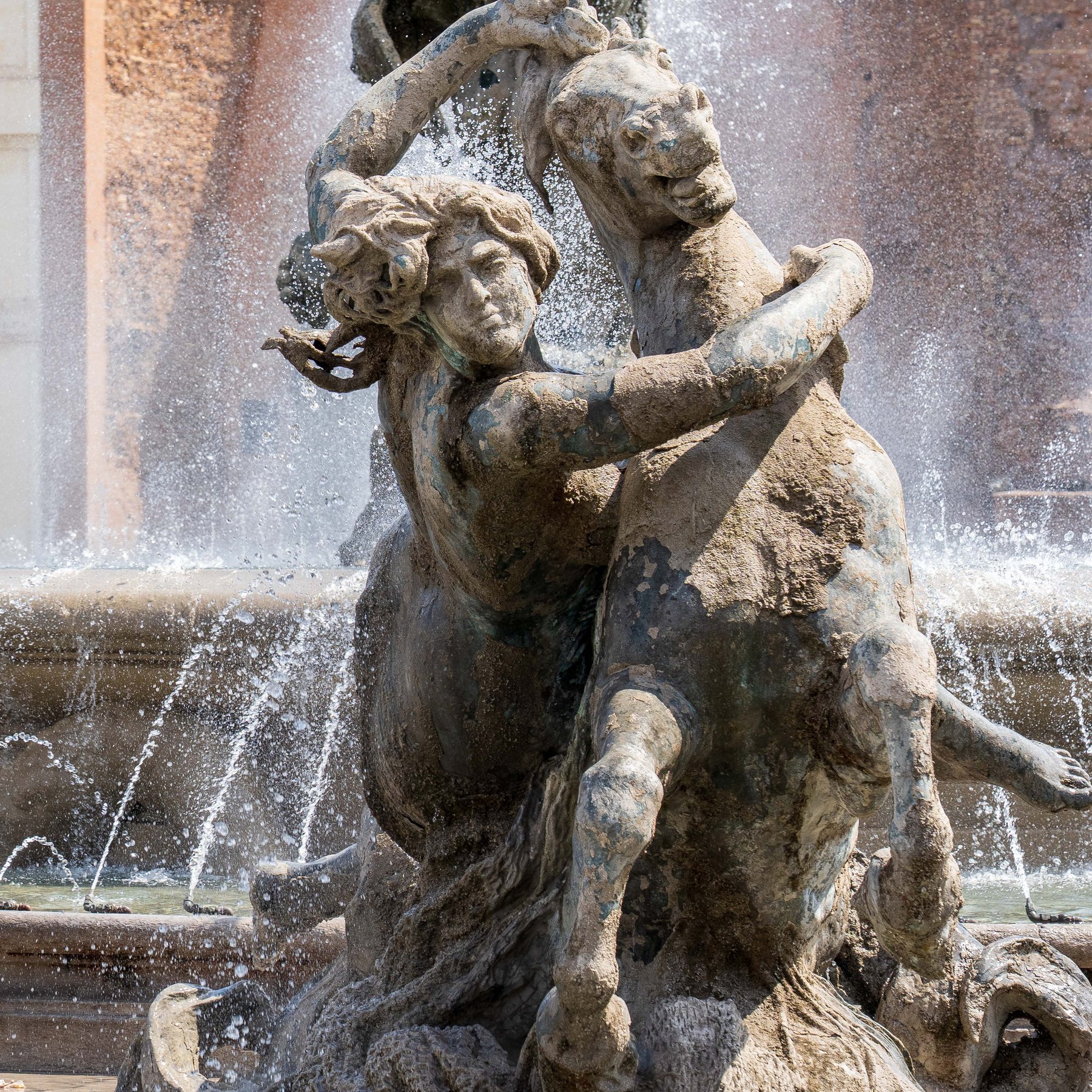 A close-up of the mythological figures at the Trevi Fountain in Rome
