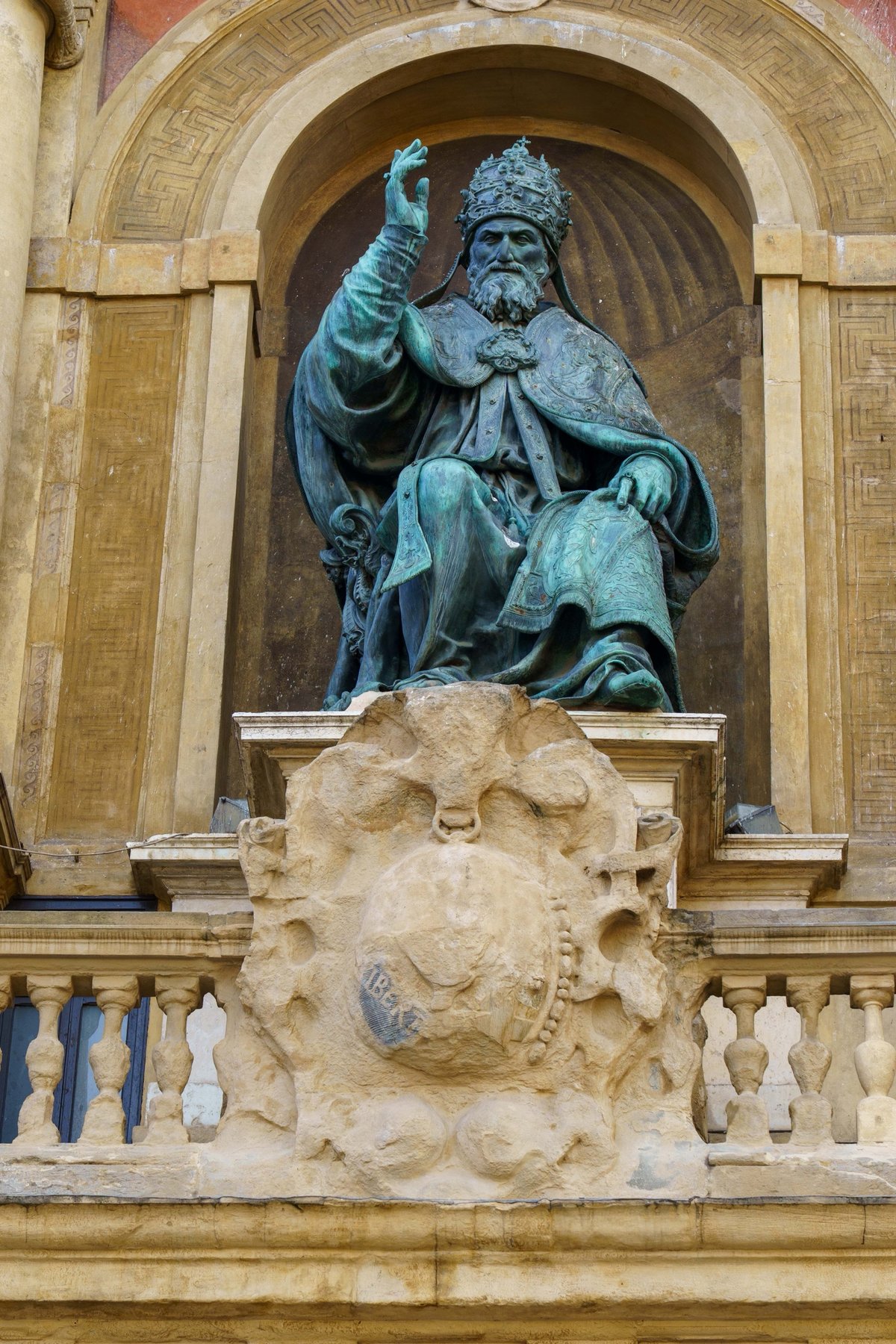 The bronze statue of Pope Gregory XIII above the entrance to Palazzo d'Accursio in Bologna