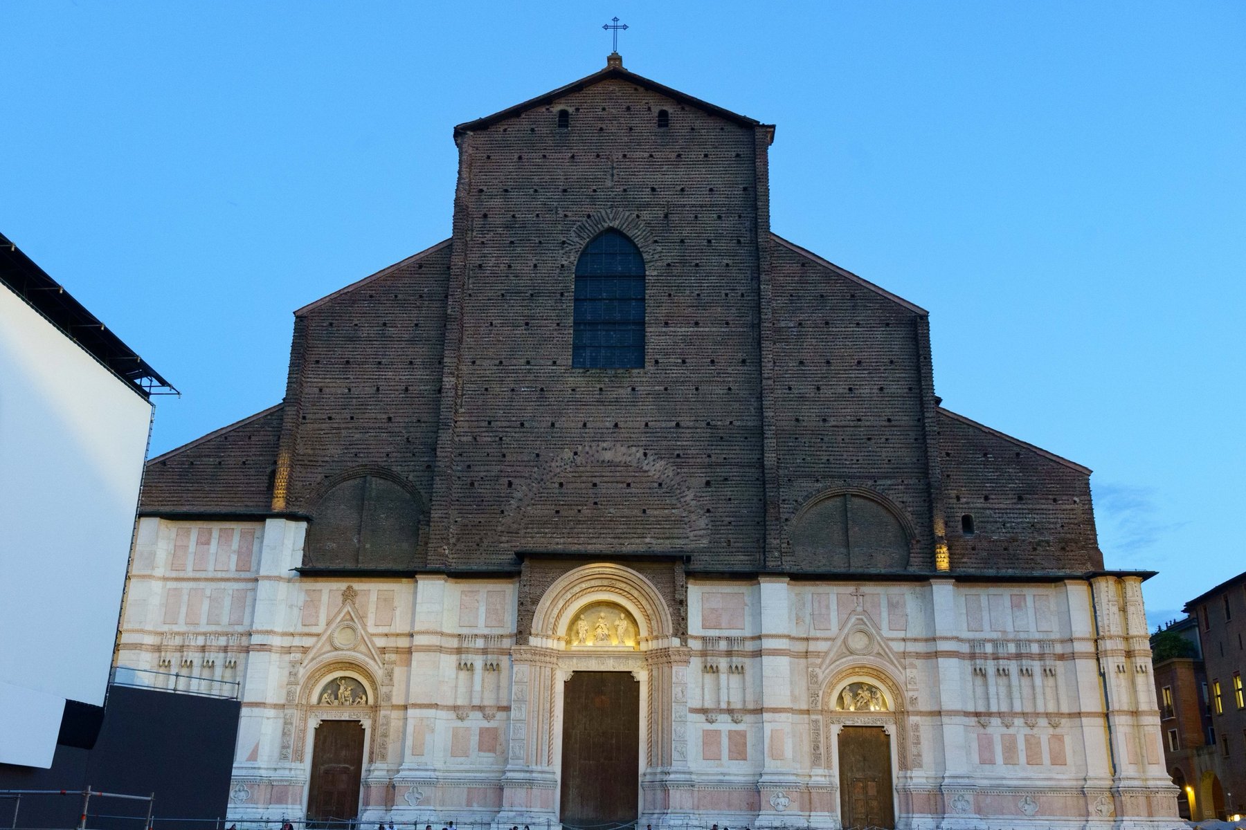The Basilica di San Petronio at dusk, its upper facade left as bare brick