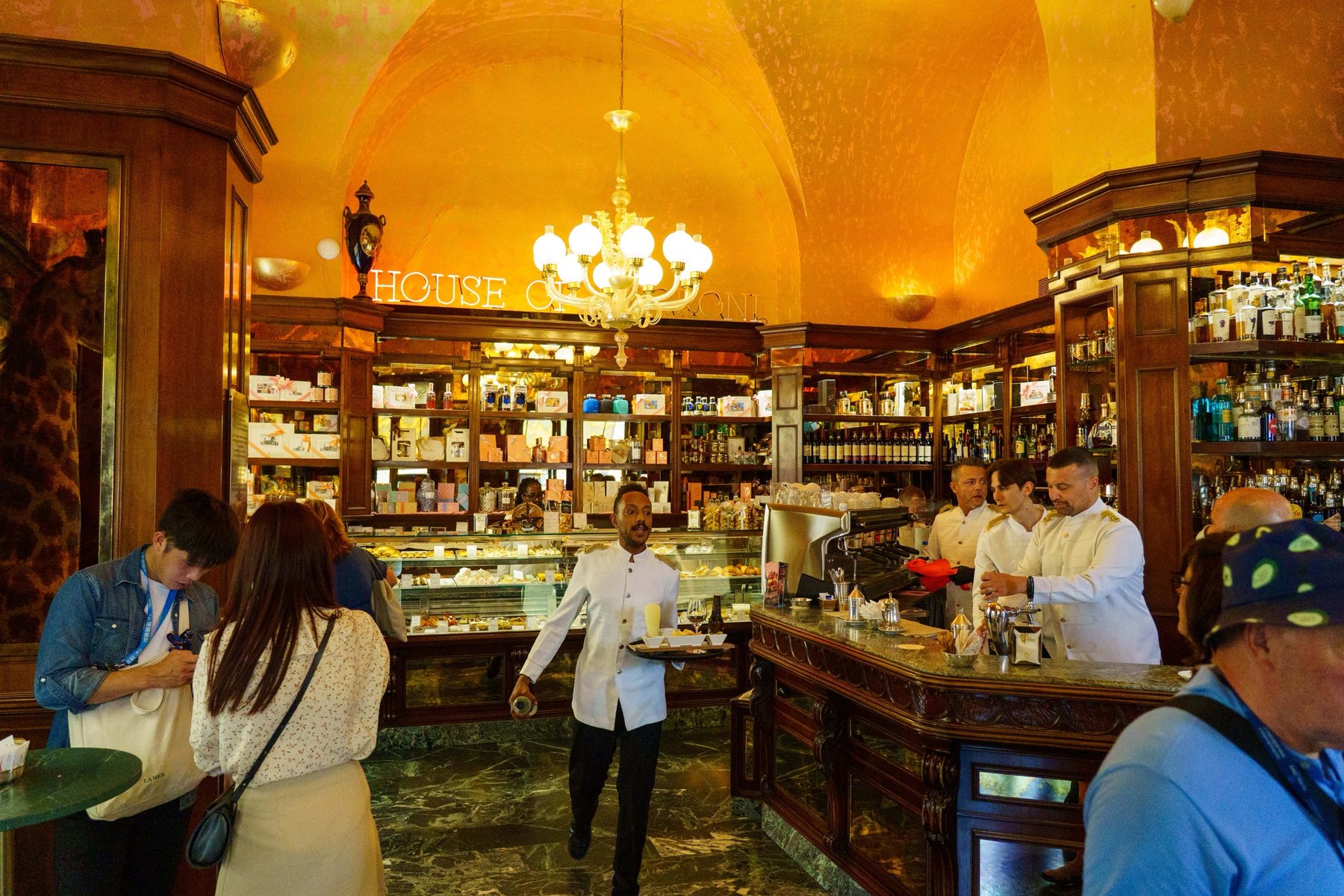 The marble counter and gilded interior of Rivoire, a historic chocolatier in Florence