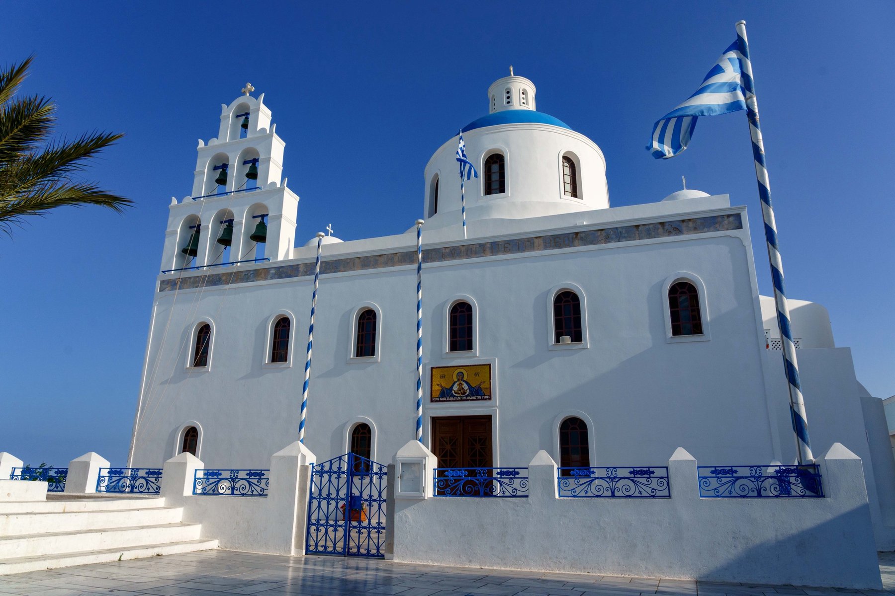 Panagia Platsani, the main church of Oia, with its blue dome and belfry