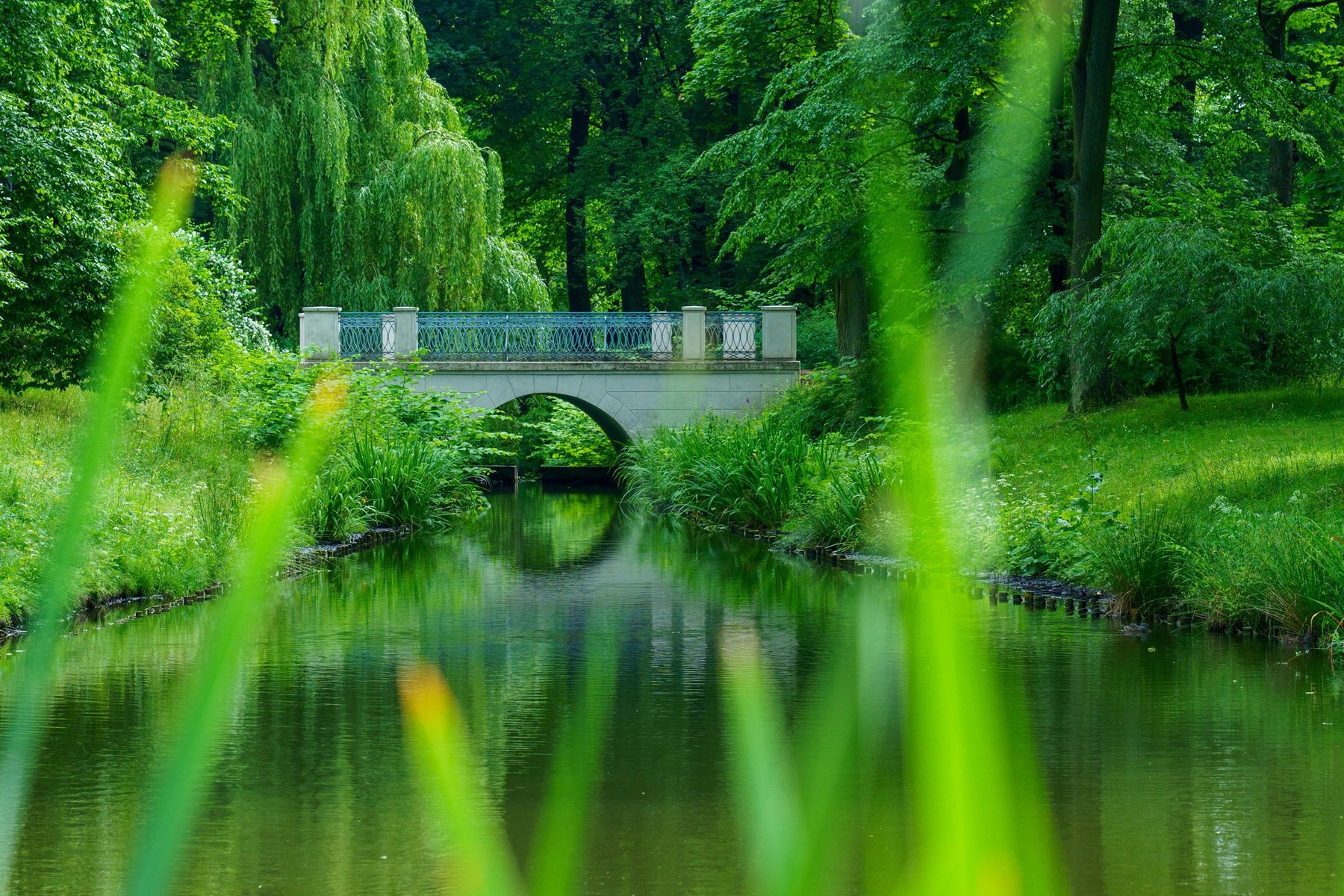 A stone bridge over the canal in Lazienki Park, Warsaw
