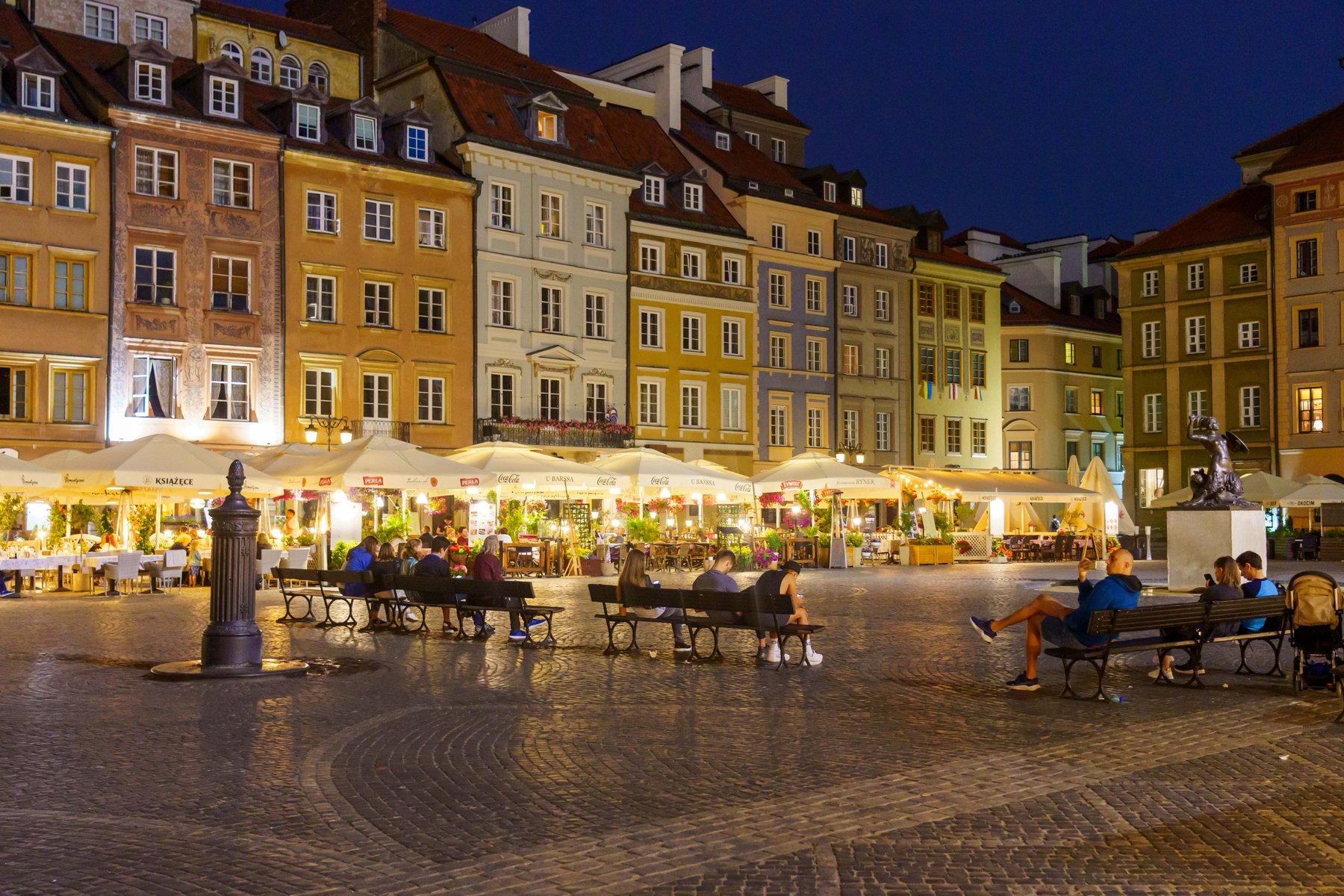 The Old Town Market Square lit up at night in Warsaw