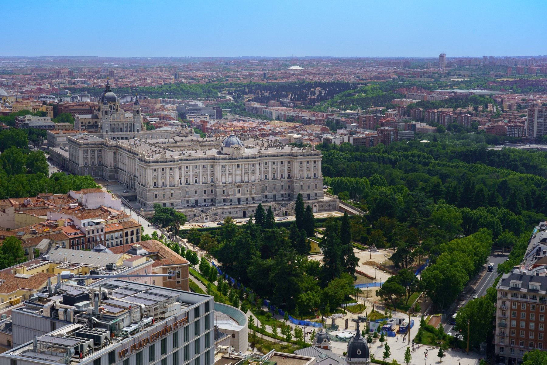 An aerial view of the Royal Palace and Almudena Cathedral from a rooftop in Madrid