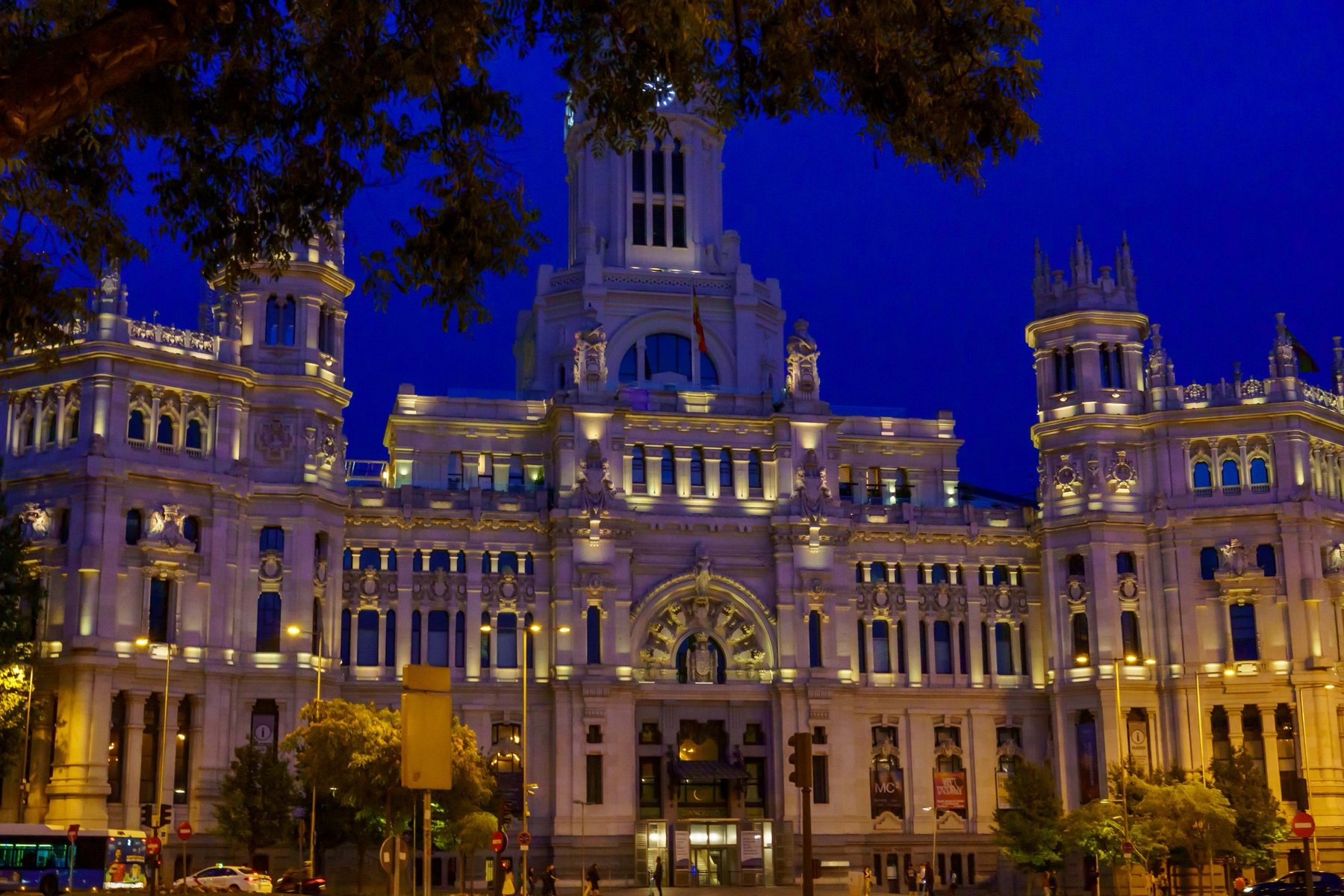 Cibeles Palace illuminated at dusk in Madrid