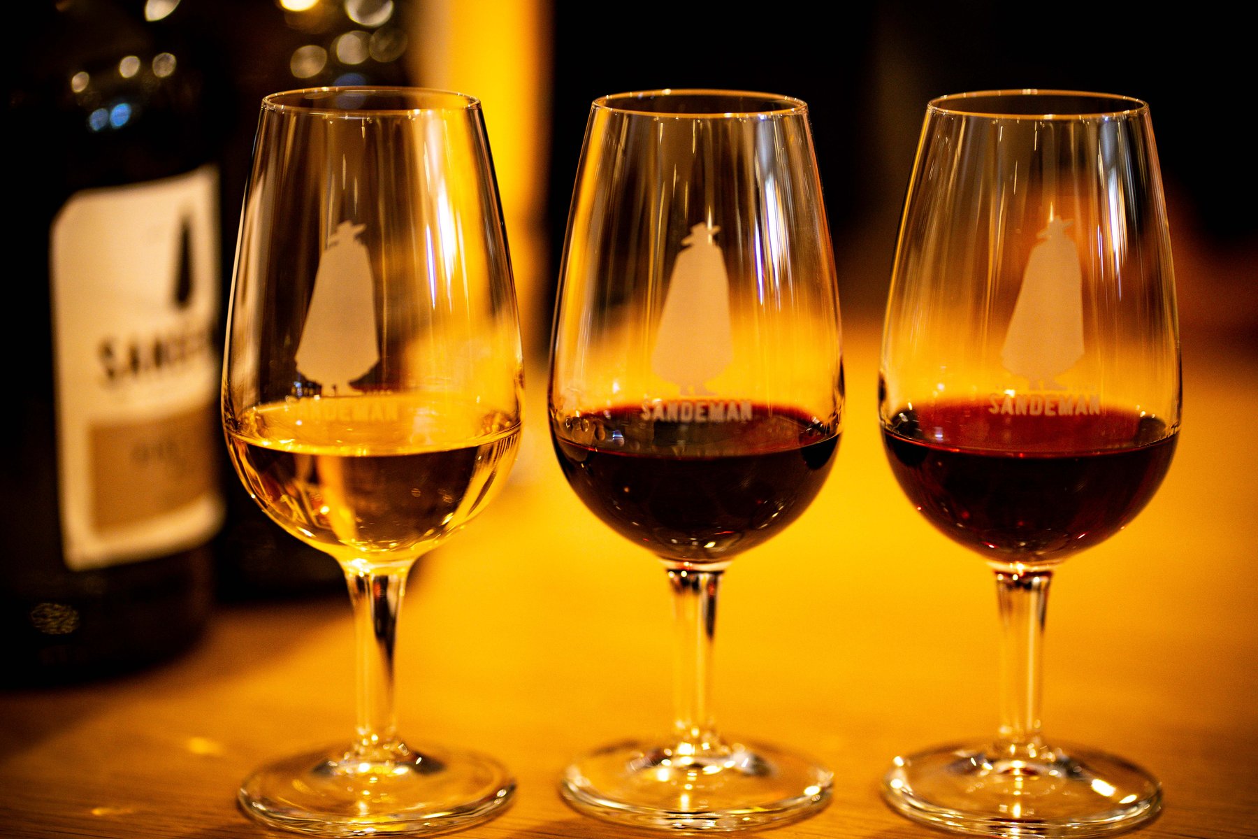 Three glasses of white, ruby, and tawny port at a Sandeman tasting