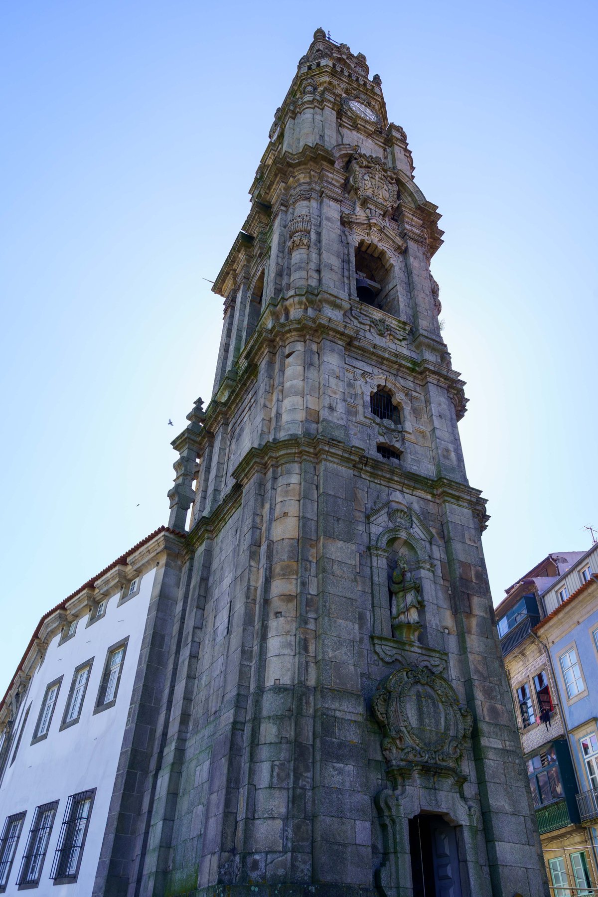 The tall granite Baroque bell tower of the Torre dos Clérigos in Porto