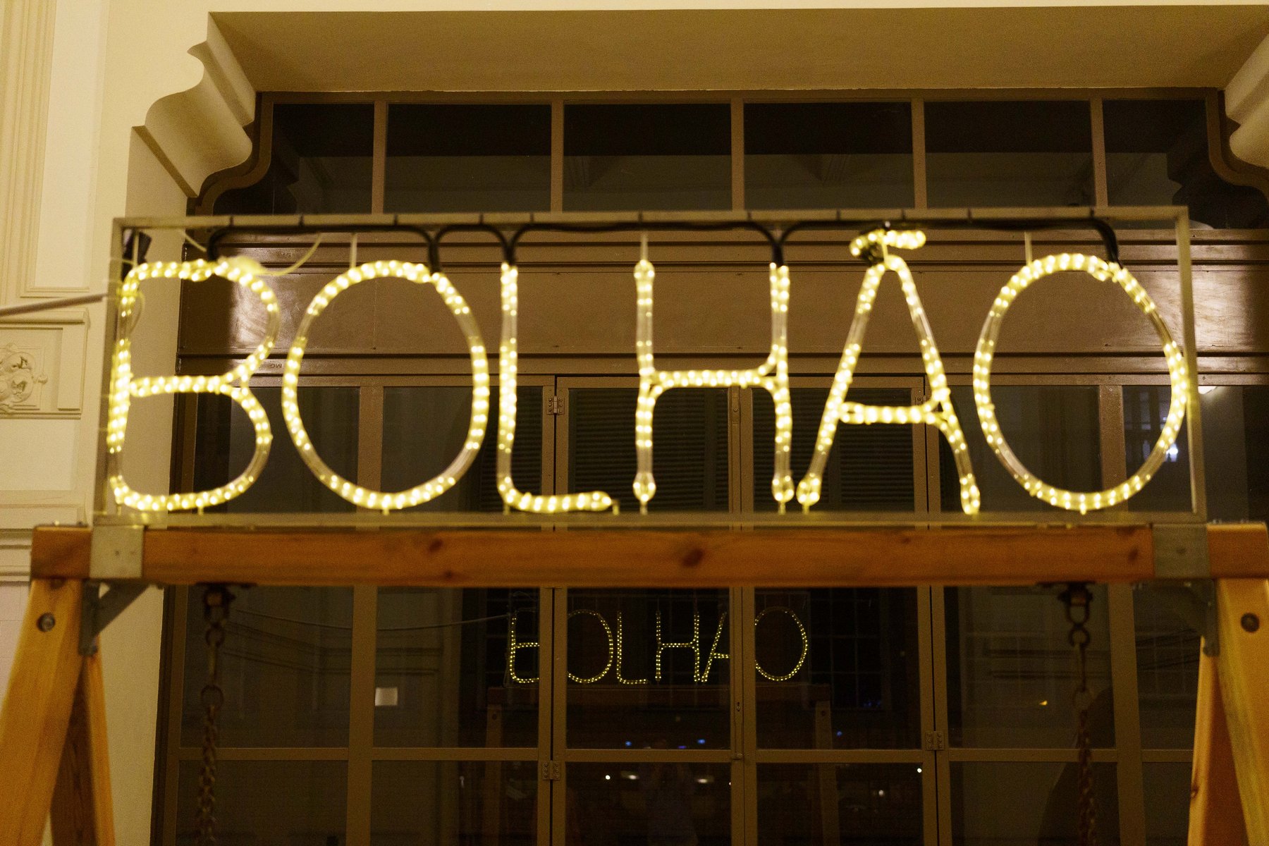 An illuminated sign reading Bolhao above the entrance to Mercado do Bolhão