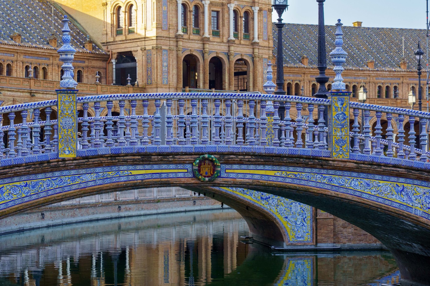 A tiled bridge over the canal at Plaza de España in Seville