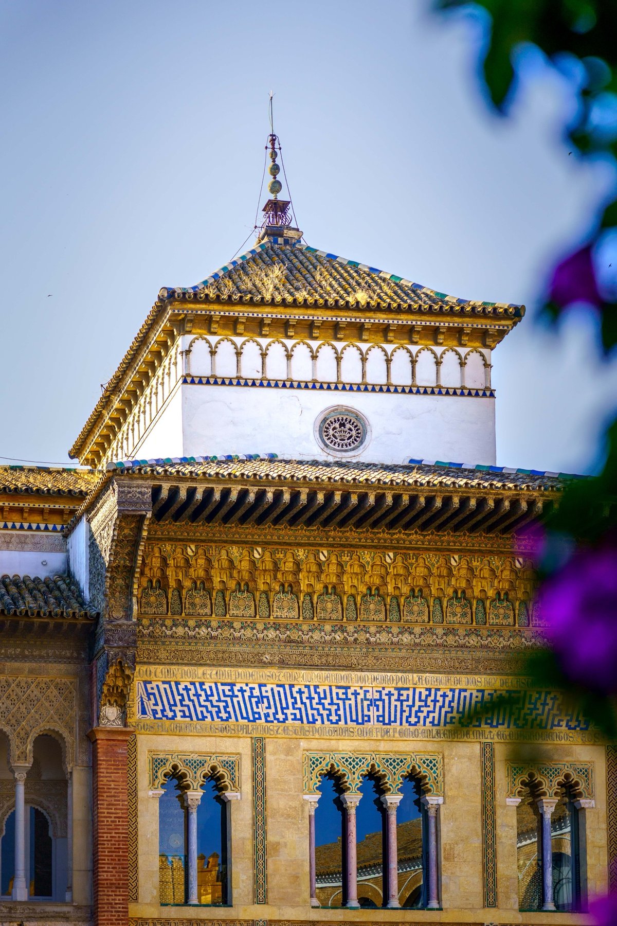 The Mudéjar upper facade of the Real Alcázar with an Arabic inscription frieze